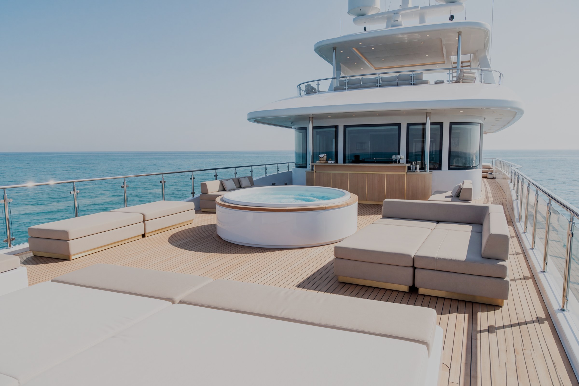 Sun deck of the sample yacht with jacuzzi, bar and sun pads