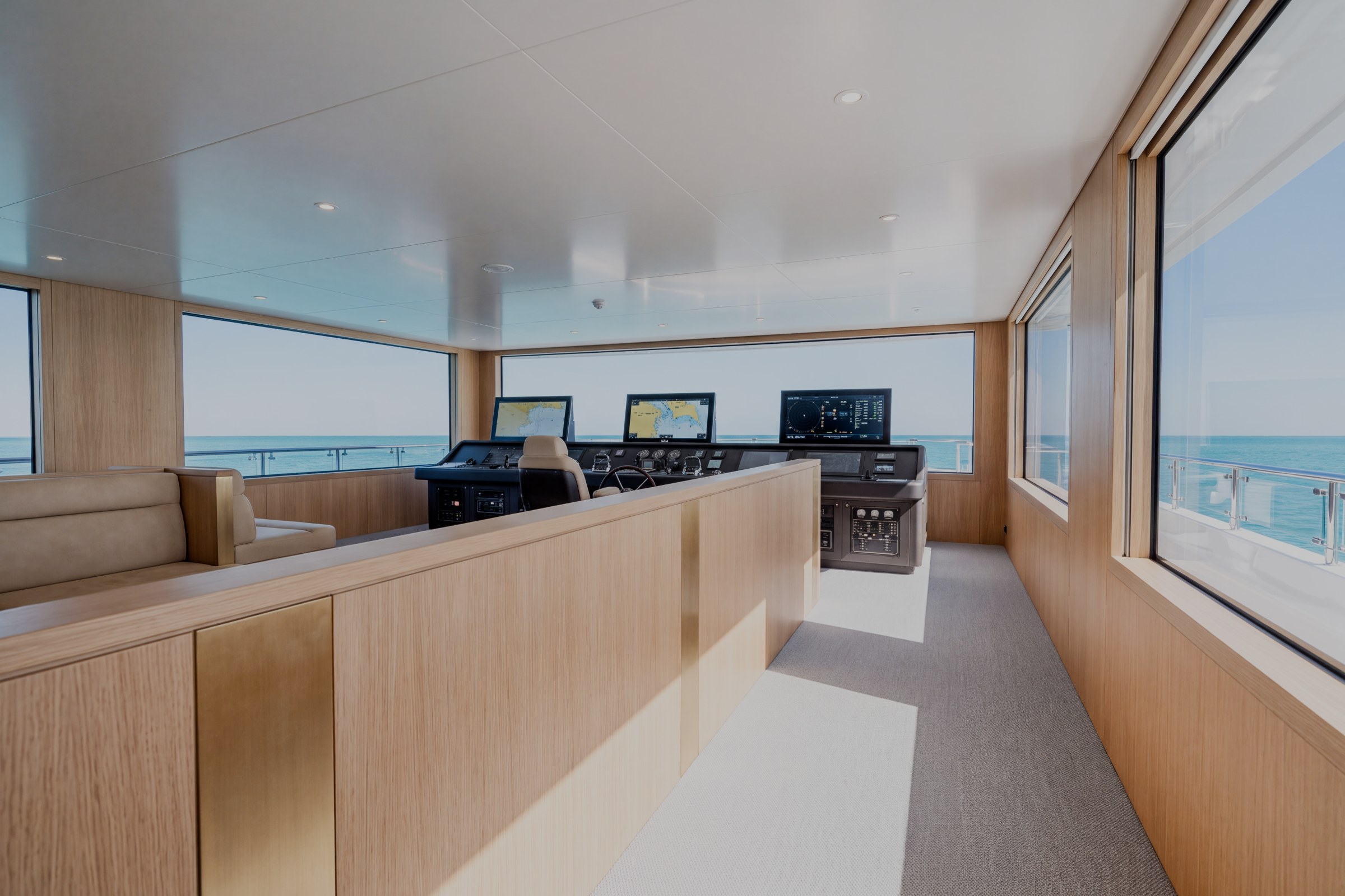 Bridge of the sample yacht with wheelhouse controls and forward windows