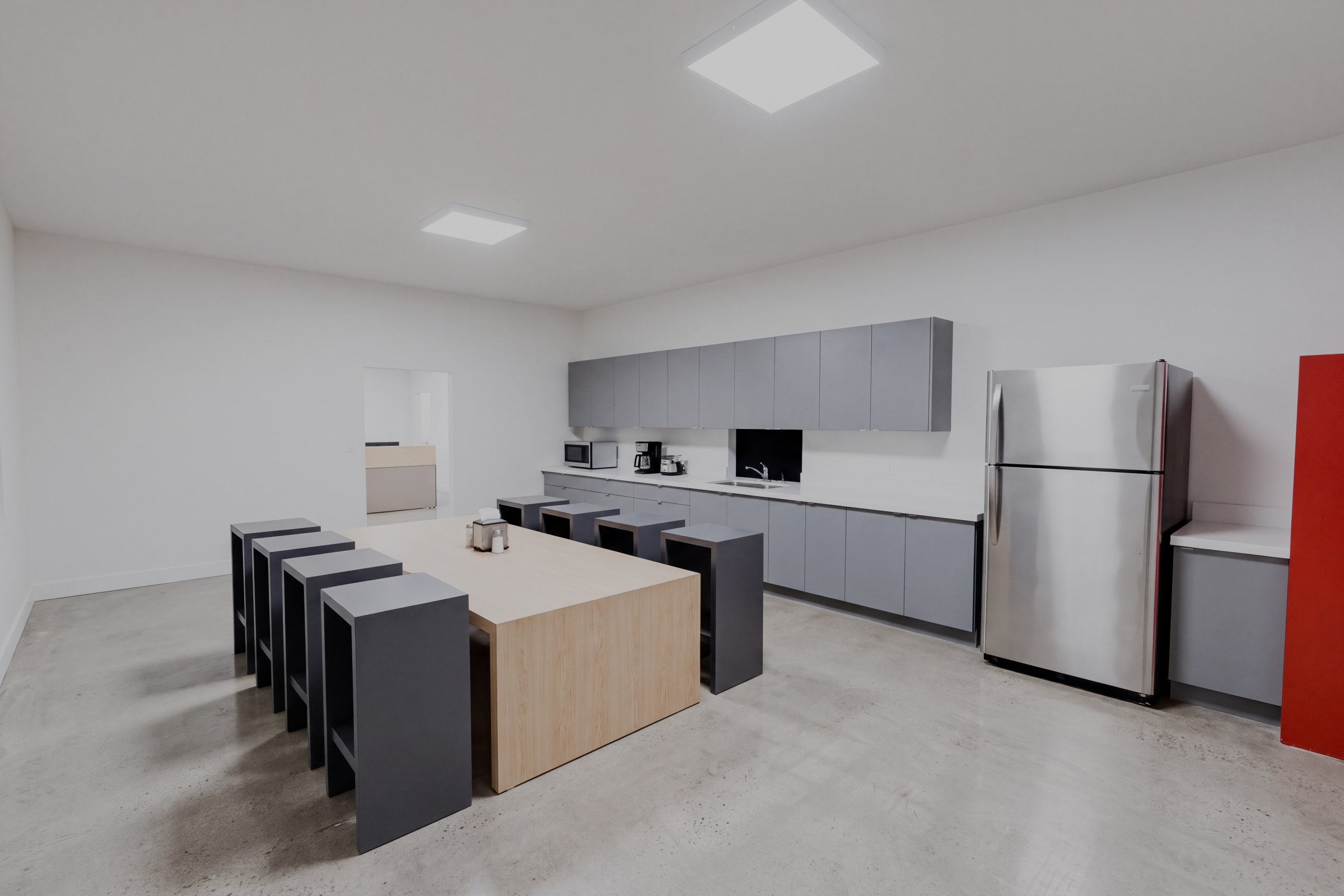 Break room in the sample warehouse office, with tables and a kitchenette